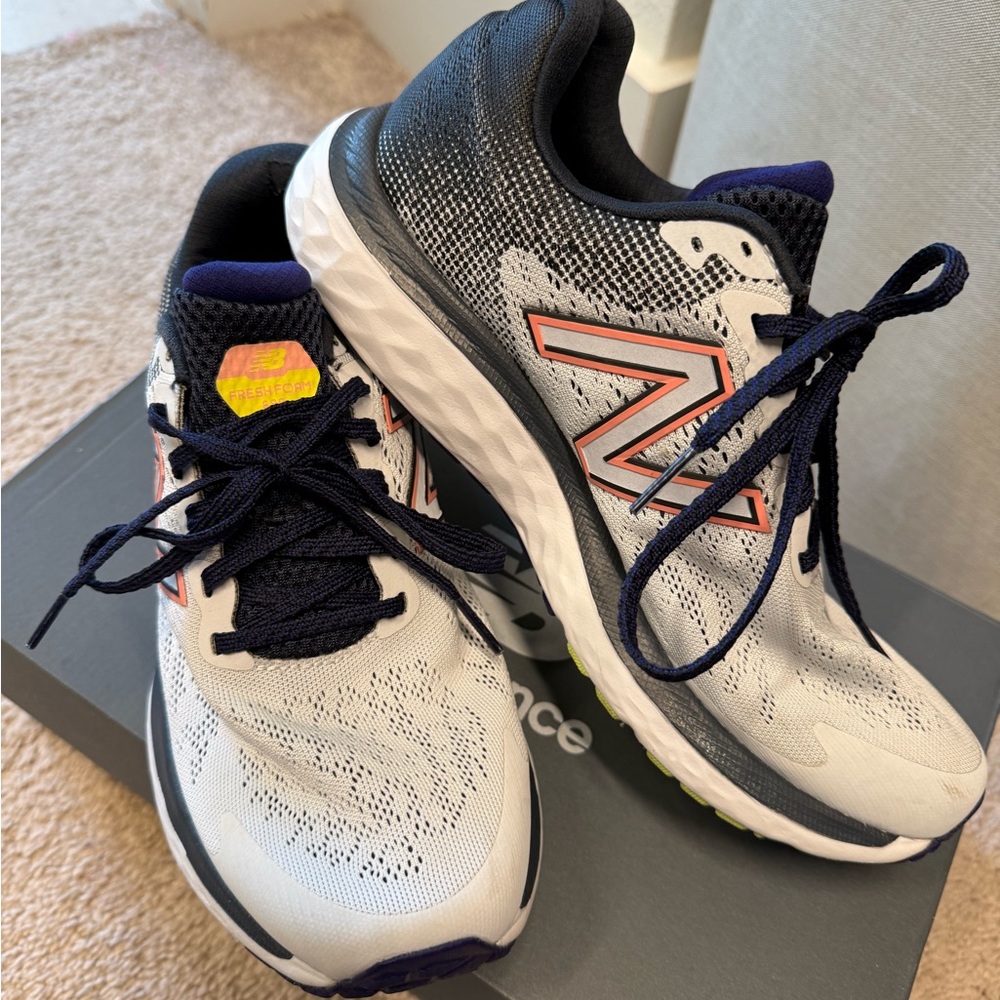 New Balance White and Black Sneakers with Orange Accents